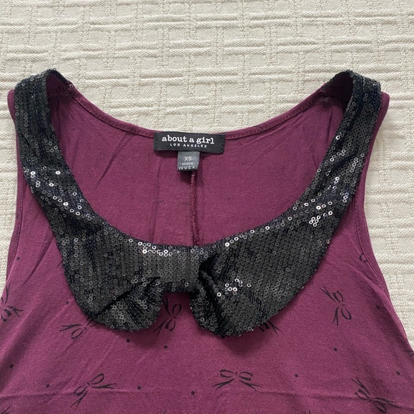 About A Girl Tops - About a Girl purple and black sequin bow tank.